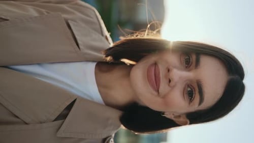 Vertical Video Joyful Charming Lady Outdoors Smiling and Posing to the Camera While Standing Outside