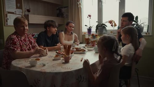 Family Gathering Around the Dining Room Table