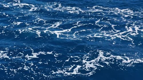 Beautiful Blue Ocean Water with White Foam