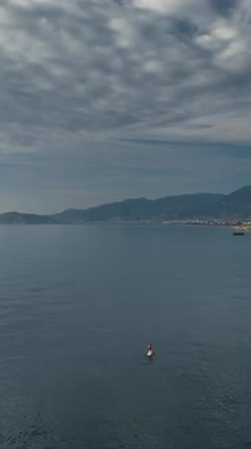 Vertical Video Surfing Bliss Aerial View of Sunset Adventure