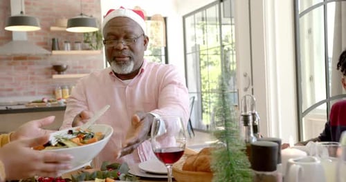 Family Christmas Celebration with Santa Hat at Dining Table