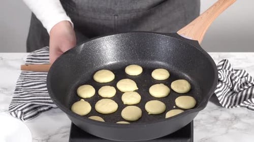 Time Lapse Step By Step Frying Mini Pancake Cereal in a Nonstick Frying Pan