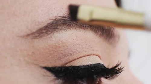 Woman Gets Eyebrows Filled In With a Brush
