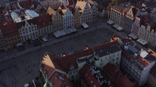 Aerial shot of the Market Square (Rynek) in Wroclaw, Poland. Camera flies backwards over the square