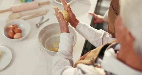 Woman and Child Baking Dough in Kitchen