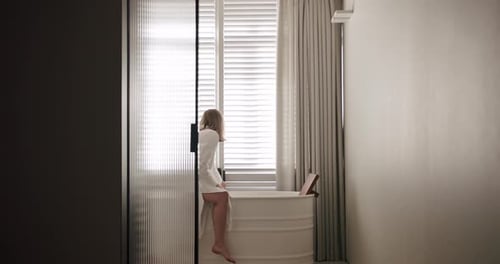 Woman with Blonde Hair in White Bathroom