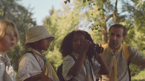Multiethnic Kids Scouting in Forest
