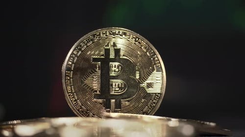 Golden Bitcoin Cryptocurrency Standing on Coins