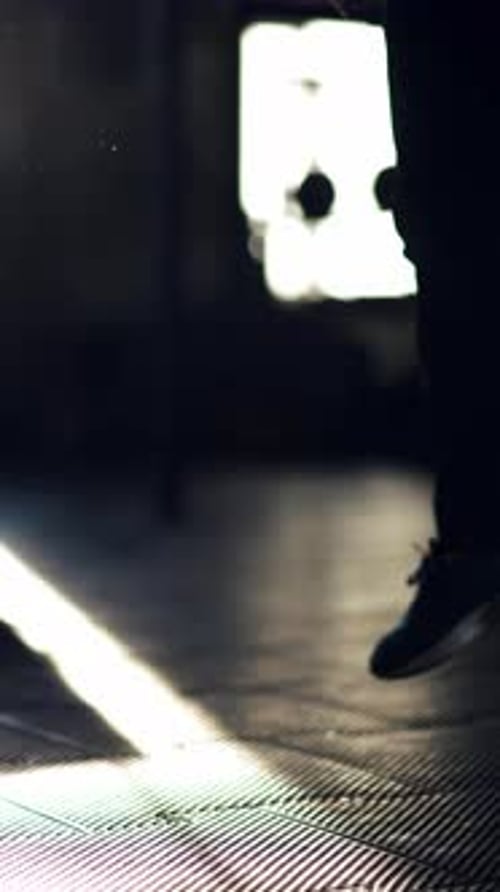 Muscular Athlete Executing Powerful Clap Pushups Revealing Intense Strength Against Dark Gym
