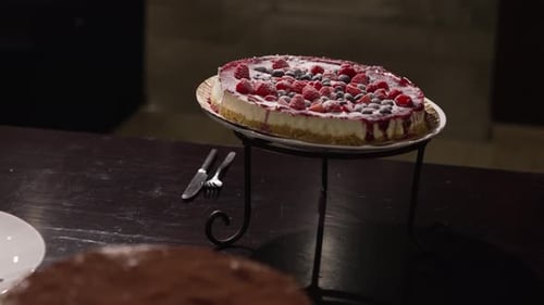 Delicious berry cheesecake on an elegant dessert stand