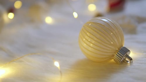 Cream Ornament With Gold Stripes Lit by Fairy Lights