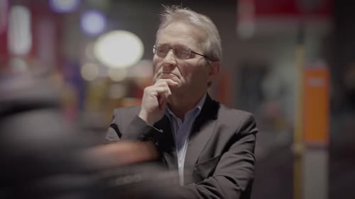 Thoughtful Elderly Gentleman with Grey Hair Thinking About Life