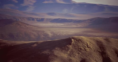 Vast Mountain Landscape Under Soft Sunlight During Early Morning Hours