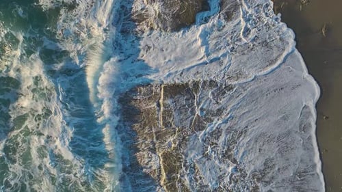 Waves Crashing on Beach from Above