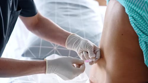 Medical Professional Administering Injection to Patient