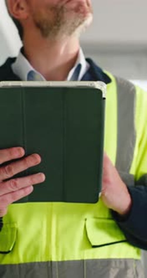 Engineer, man and hands in building with tablet, project inspection and property development