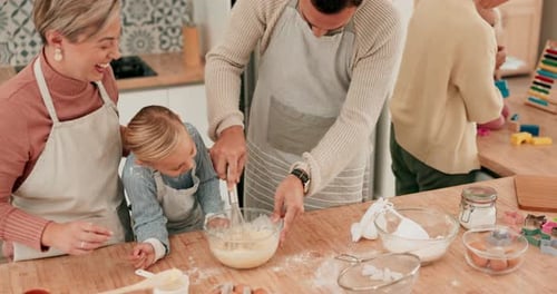 Parent and Child Baking Together in Kitchen