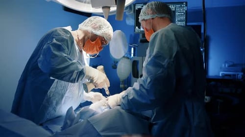 Surgeons Performing Operation in Hospital Operating Room