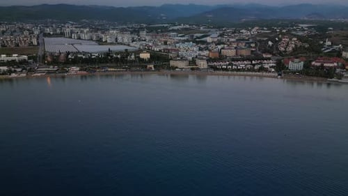 Aerial View of Coastal City at Sunrise