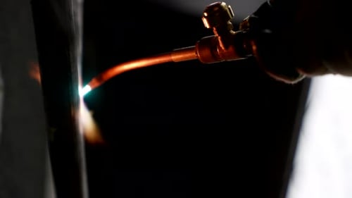 Closeup View of Welding Process in Industrial Plant Welder Connecting Two Metal Details