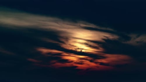 Red Sun Among Dark Clouds