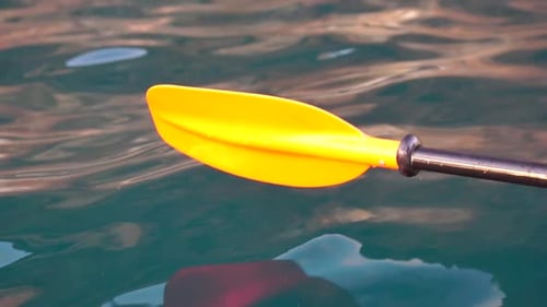 Kayak Paddle Sunset Low Angle View Over Clear Azure Sea Water Sun Glare Abstract Nautical Summer