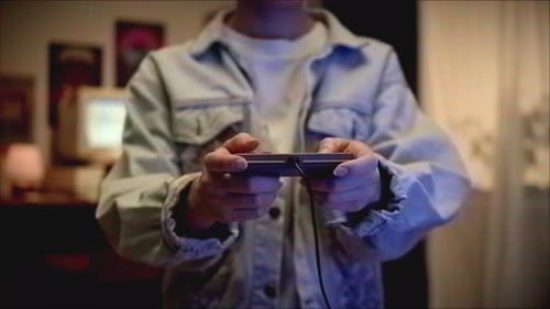 Close Up of Person Holding Game Controller