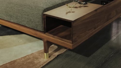 Modern couch design with wooden frame and accents