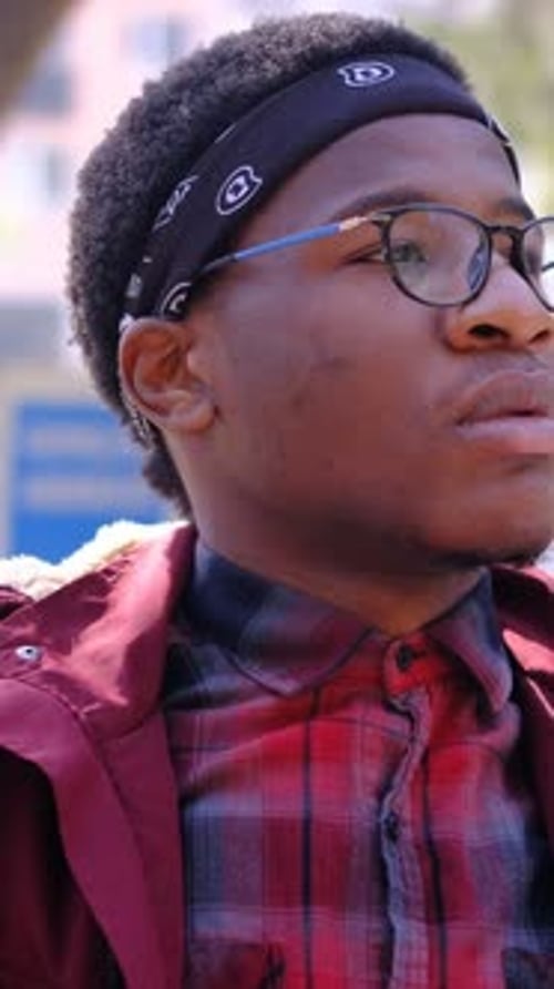Black Man Takes Off His Mask