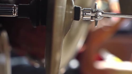 Drum set plate played by drummer at concert, close up view vertical