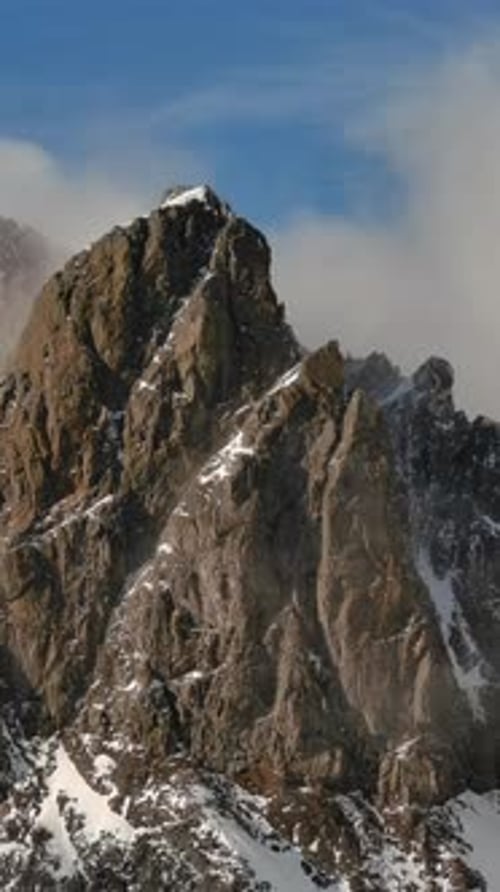 Snowy Mountain Peaks With Dramatic Clouds. British Columbia, Canada.