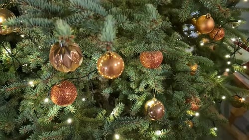 Festive Christmas Tree Decorated with Gold Ornaments