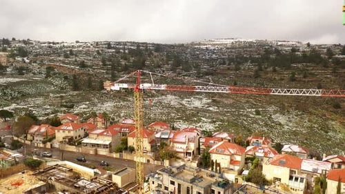 Jerusalem red rooftops in the snow aerial view