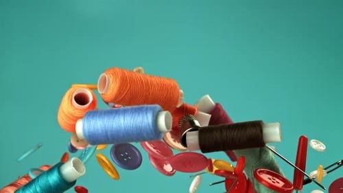 Colorful Sewing Supplies Floating on Teal Background