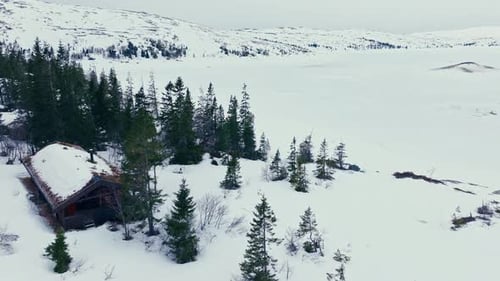 Chalet Isolated In Snow Covered Mountains In Verran, Indre Fosen, Norway. Aerial Drone Shot