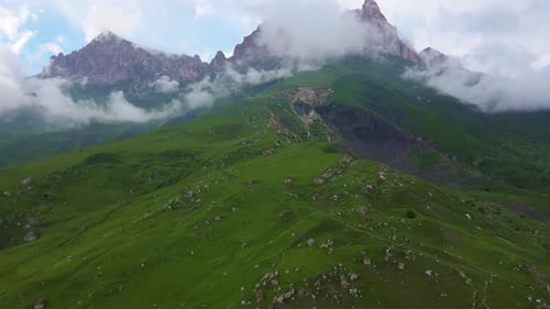 Aerial View of the Mountainside and Beautiful Alpine Green Meadows