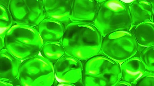 Green spheres moving and reflecting light