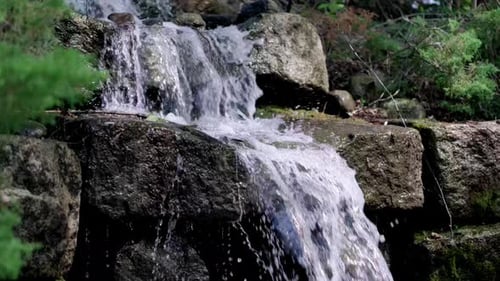 Medium shot of a small waterfall in Brewer Maine