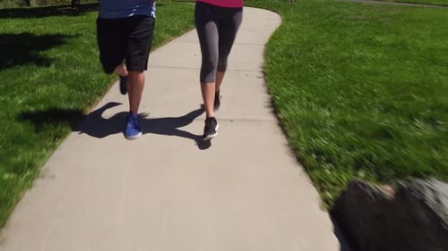 Couple Running at Park Active