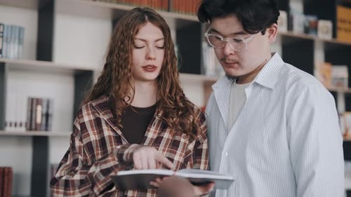 University students studying together in a library