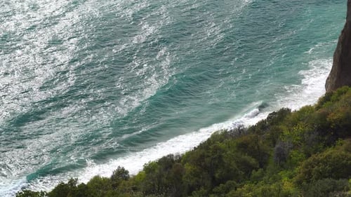 Sea Landscape with Rocky Coastline on Sunset Time Stormy Sea on a Background of Rocky Shores The