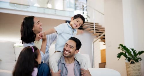 Happy Family Laughing Together in Modern Home