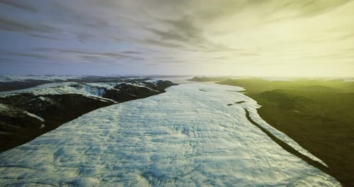 Frozen Landscape Glows Sunlit Icy Plains with Distant Fjords and Shadows