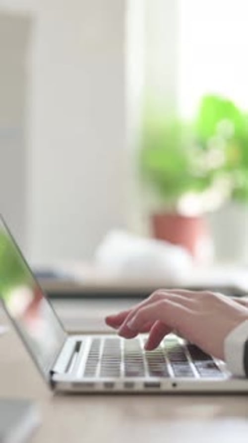 Close Up of Young Businesswoman Typing on Laptop, Vertical Video