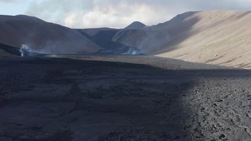 Natthagi valley in Iceland with black basalt flow from volcano eruption