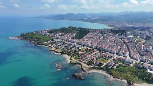 Aerial view of a vibrant coastal cityscape by the sea