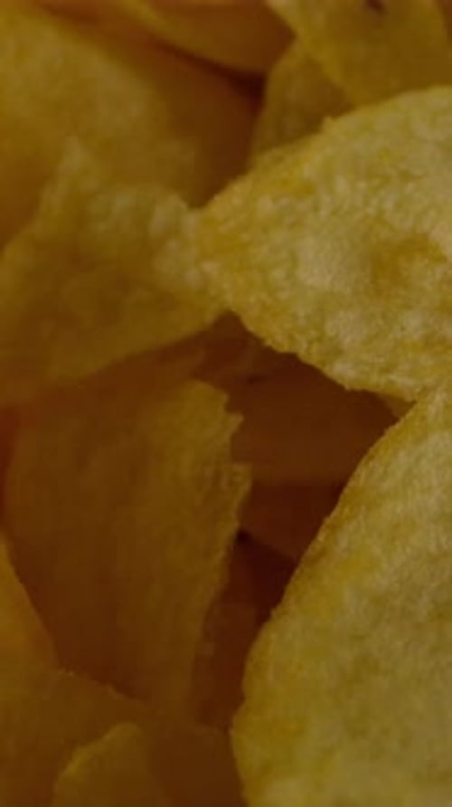 Vertical of Fresh Potato Chips with Salt