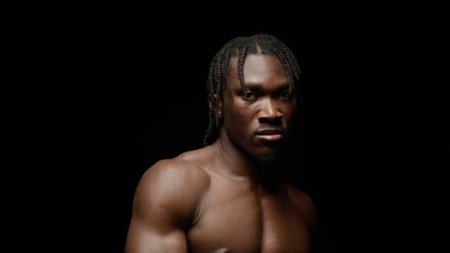 Muscular Man Portrait with Braided Hair
