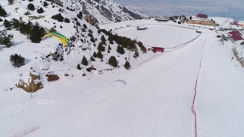 Winter Mountain Landscape with Paraglider Launching