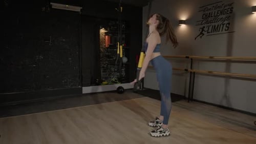 Slim Active Sporty Fit Woman Doing Standing Half Forward Bend Stretch with Trx